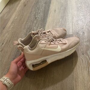 Nike Pink Sneakers with Air Cushioning and Layered Sole